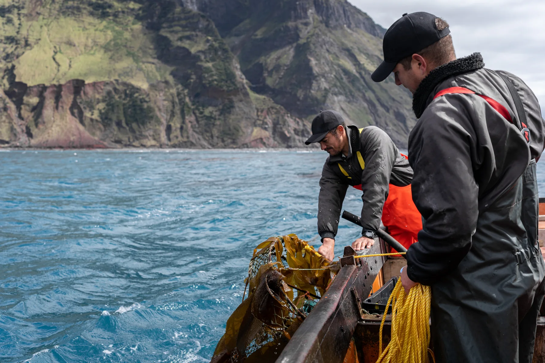 Fishermen hauling a pot at sea